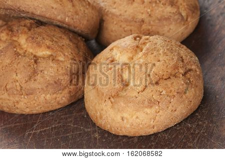 Cakes with succade oa timber board close up