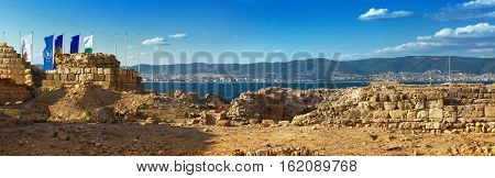 Nesebar Bulgaria - August 30 2013: Ancient ruins and the remains of an old fortress wall in the old town of Nessebar on the Black Sea coast. UNESCO world heritage site. Panoramic shot.