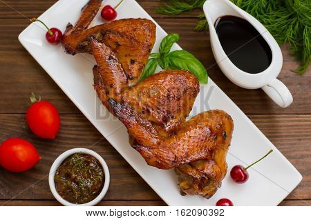 Marinated chicken wings in Japanese. On a wooden table. Top view