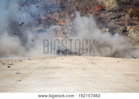 smoke and movement of car part blown away from explosion in post blast investigation course training