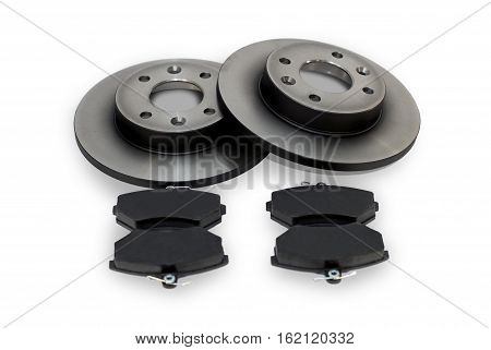 four brake pads and two new brake discs for the car