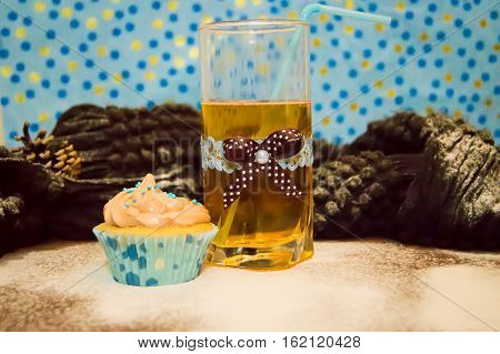 cake and a glass of water on the wooden background