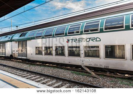 BERGAMO, ITALY - DECEMBER 2016: Train of the local Italian company Trenord at station of Bergamo town.