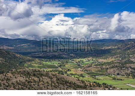 Orchards Vineyards and famland from Giants Head Mountain near Summerland British Columbia Canada on a summer day
