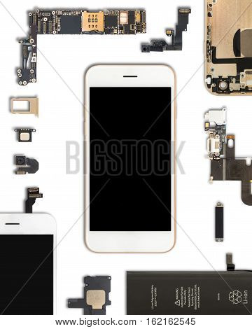 Flat Lay (Top view) of smartphone is surrounded by its own components isolate on white background with clipping path in 4:5 aspect ratio