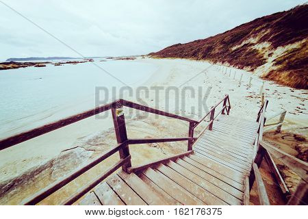 Steps leading down to beach at .Torndirrup National Park Albany Western Australia Australia.vintage toning filter add .