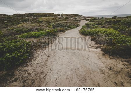 Steps leading down to beach at Torndirrup National Park Albany Western Australia Australia.vintage toning filter add .