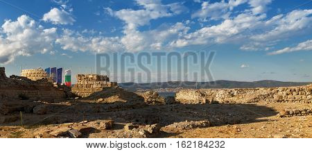 Nesebar Bulgaria - September 06 2013: Ruins and the remains of an ancient fortress wall in the old town of Nessebar on the Black Sea coast. UNESCO world heritage site. Panoramic shot.