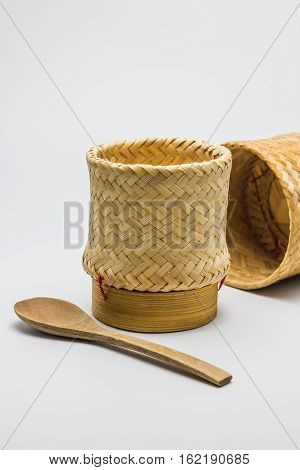 Kratip or Wicker bamboo container rice white background.