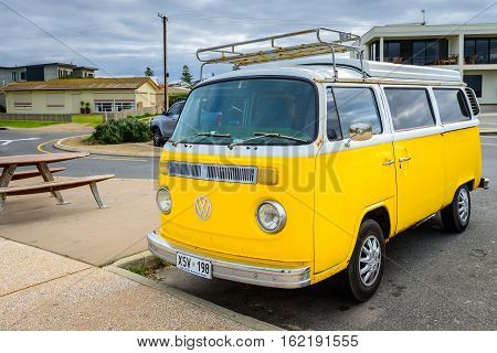 Adelaide Australia - August 14 2016: Classic yellow Volkswagen Transporter camper van parked on a street at Middleton beachfront