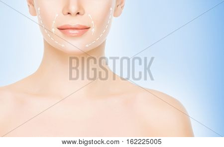 Close-up half face portrait of young, attractive woman with arrows on her face. Face lifting concept.
