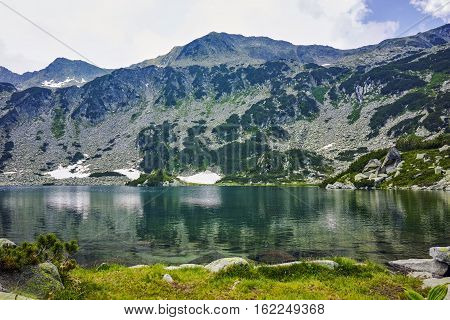 Clouds over Banderitsa fish lake, Pirin Mountain, Bulgaria