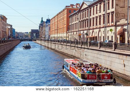 Saint Petersburg, Russia - July 26, 2014:  A Tour Boat With Tourists On The Moika