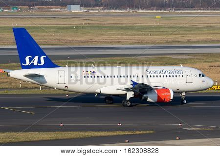 DUSSELDORF GERMANY - DEC 16 2016: Airbus A319 from SAS Scandinavian Airlines taxiing before take off from Dusseldorf airport