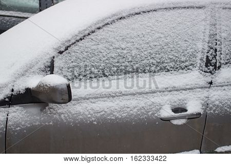 The car filled up by snow in the daytime
