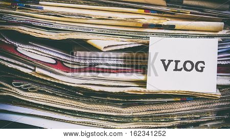 A Stack Of Old Newspapers, Words On A Paper Sticker