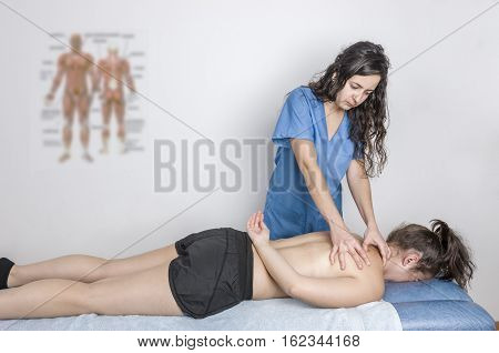 Physiotherapist, Chiropractor Giving A Massage And Stretching Of Subscapularis And Rhomboid