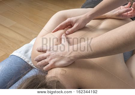 Physiotherapist, Chiropractor Giving A Massage And Stretching Of Subscapularis And Rhomboid