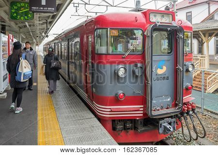 TOKYO, JAPAN - 20 NOV 2016 : Train stopped at Karuizawa Railway station.The railway system is one of the most important public transportation in Japan.
