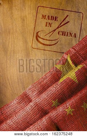 Flag of China and the stamp impression is made in China with chopsticks.