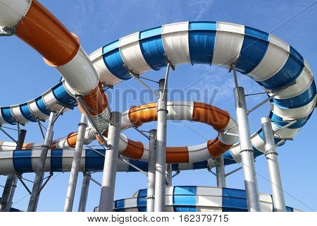 Slider in swimming pool and sky background