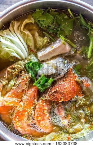 Seafood spicy hot pot crab prawn fish squid tumyum