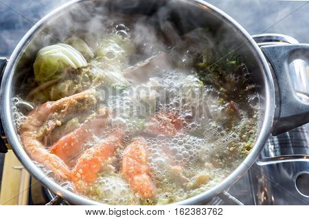 Seafood spicy hot pot crab prawn fish squid tumyum