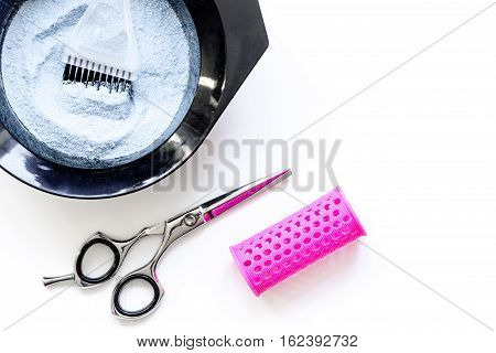Tools for hair dye and hairdye top view on white background