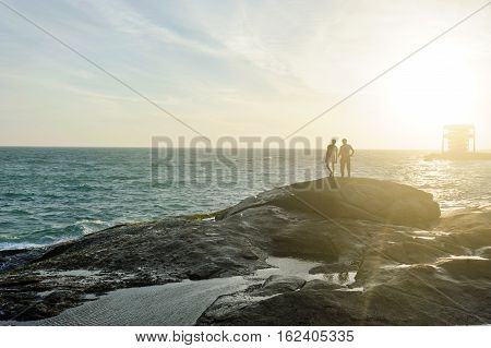 Two people on Indian Ocean coast in Kanyakumary the southernmost point of the Indian subcontinental Tamil Nadu India