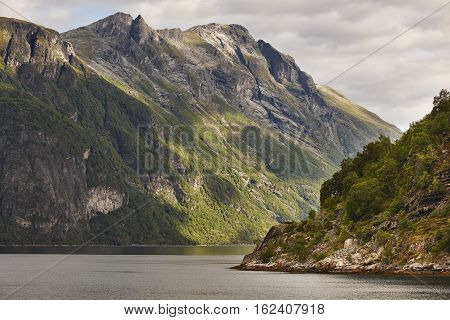 Norwegian fjord landscape. Hellesylt-Geiranger cruise route. Visit Norway. Travel