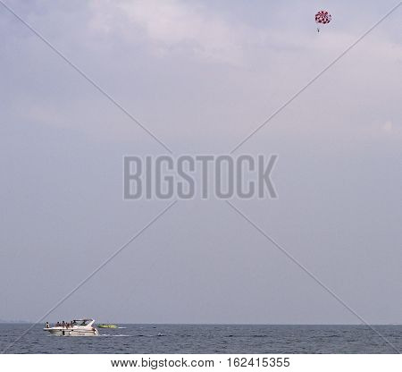 Sochi, Russia - August 23, 2016: people are riding in yacht nearly seashore of Sochi, Russia