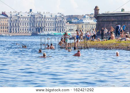Saint Petersburg, Russia - July 26, 2014:  Residents Swim In The River Neva On The Beach Near The Pe