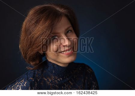 Portrait Of A Middle Age Woman In Blue Dress