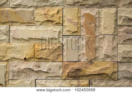 Stone wall from small pieces in gray color