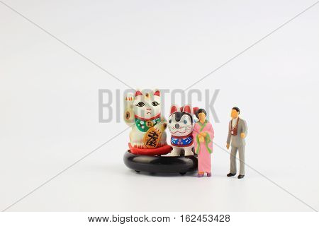 Plastic geisha doll on a white back ground.