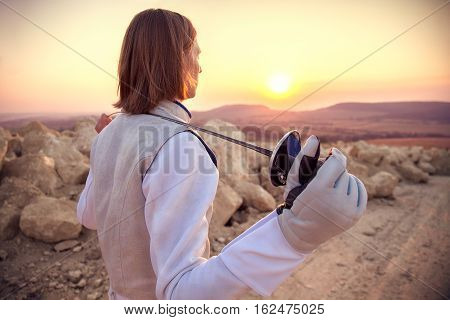 Fencer Man Holding His Sword On The Shoulders