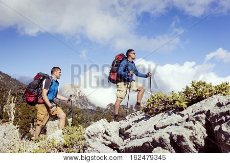 Hiking in the mountains in the summer on a sunny day.