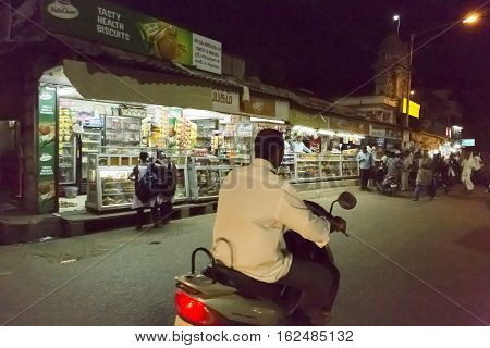 Illustrative image. Pondicherry, Tamil Nadu, India - Marsh 10, 2014. Village and city by night in India area. Life during the night.
