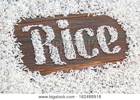 the word rice written letters of rice on a wooden board