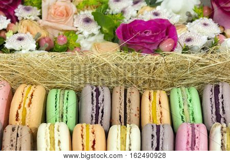 French cake macaron biscuits with different fruit fillings flowers roses chrysanthemums dessert berries