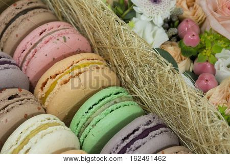 French cakes macaron sweets with fruit filling dessert flowers gift