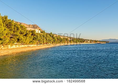 Beautiful sunshine on the Tucepi town beach.