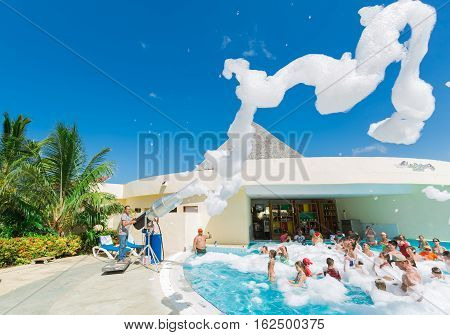 Cayo Coco island, Memories Carib hotel, July 2, 2016, amazing beautiful, gorgeous view of happy smiling joyful people relaxing and enjoying their time in swimming pool foam party on sunny day