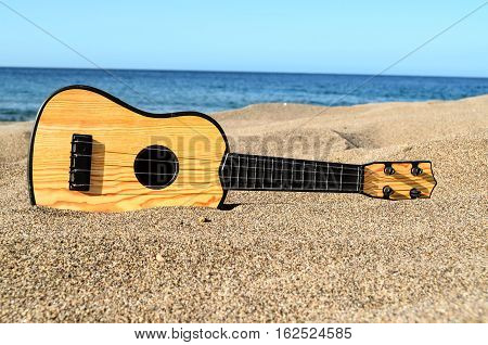 Guitar On The Sand Beach