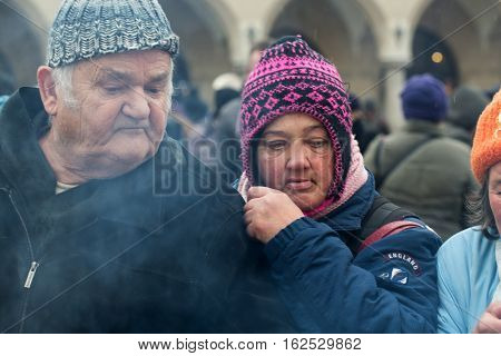 CRACOW POLAND - DECEMBER 18 2016: Christmas Eve for poor and homeless on the Central Market in Cracow. Every year the group Kosciuszko prepares the greatest eve in the open air in Poland