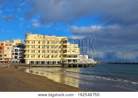 16.12.2016. View of Hotel in El Medano Beach at sunset.El Medano town one of the world's best windsurfing and kitesurfing locations.