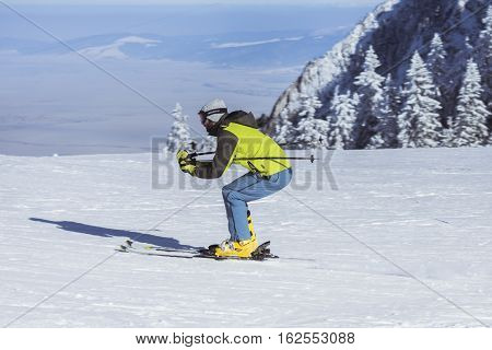 Poiana Brasov Romania - January 24 2016:Skier on the ski in the snowy winter season in the mountain resort of Poiana Brasov Romania