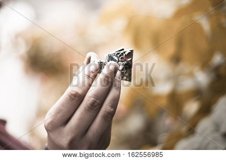 Hand of a girl holding hair pin.
