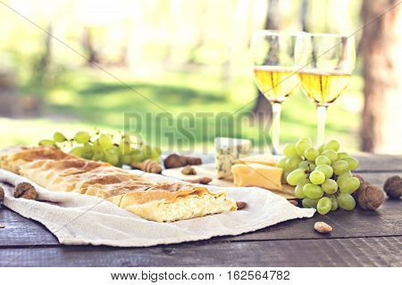 Сheese pie strudel with cheese cheese pie 4. Wine grapes nuts cheese blue cheese and coffee. dinner lunch romantic date picnic eating on nature.