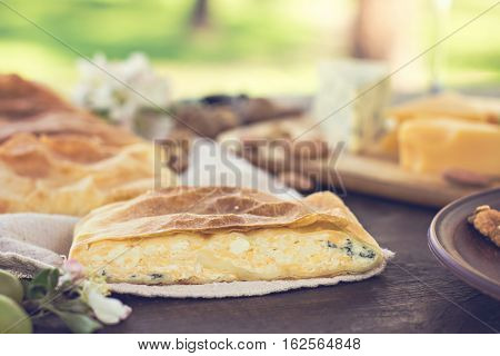 Сheese pie strudel with cheese cheese pie 4. Wine grapes nuts cheese blue cheese and coffee. dinner lunch romantic date picnic eating on nature.